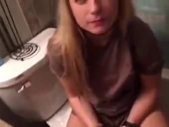 Cute girl gives blowjob on toilet at a party
